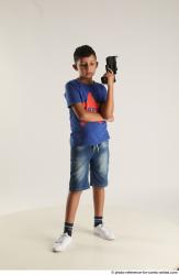 TIMBO STANDING POSE WITH GUN